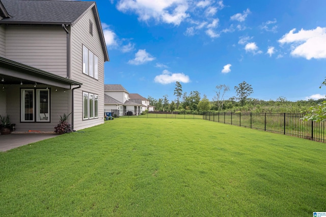 view of yard with a patio area and a fenced backyard