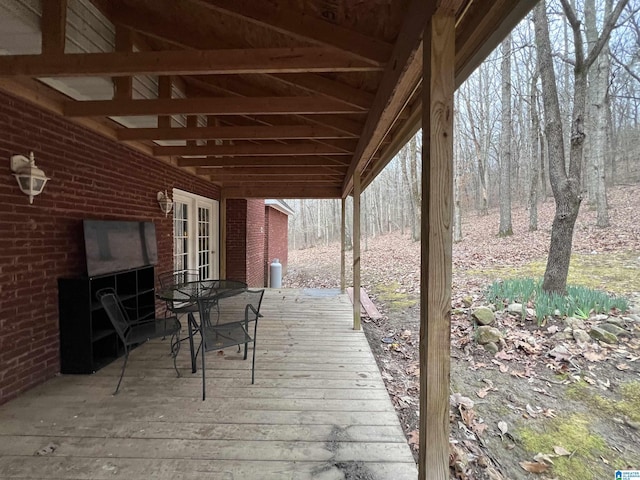 wooden deck with outdoor dining space