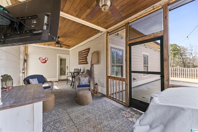 view of patio / terrace with a ceiling fan and fence