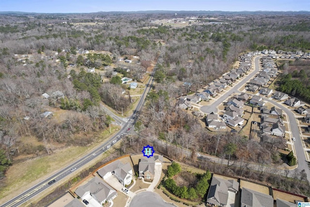 birds eye view of property with a residential view