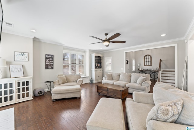 living area with visible vents, ceiling fan, stairway, dark wood-style flooring, and crown molding