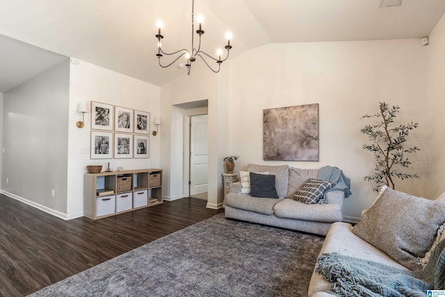 living area with lofted ceiling, a notable chandelier, baseboards, and wood finished floors