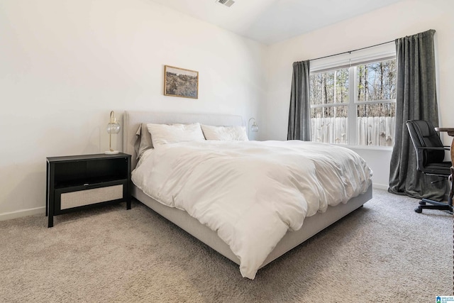 bedroom featuring carpet, visible vents, and baseboards