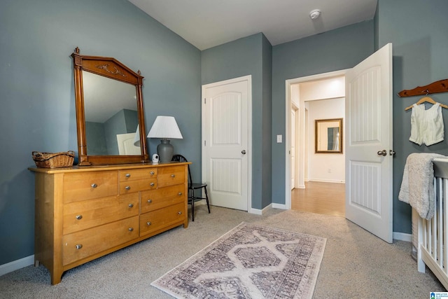 bedroom with carpet floors and baseboards