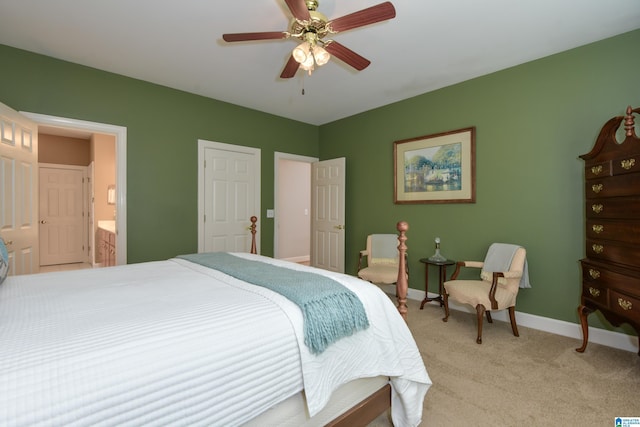 bedroom featuring ceiling fan, baseboards, connected bathroom, and light colored carpet