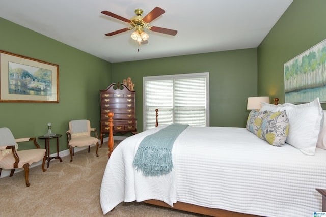 bedroom with a ceiling fan and carpet flooring