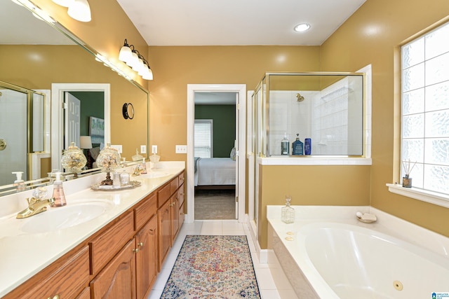 full bathroom featuring a garden tub, a sink, a shower stall, double vanity, and ensuite bath