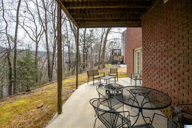 view of patio featuring outdoor dining space