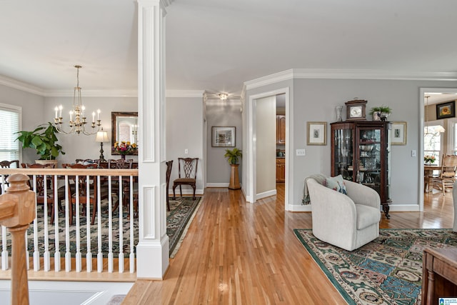 entrance foyer with light wood-type flooring and crown molding