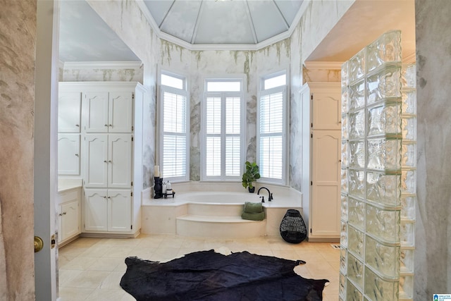 full bathroom featuring ornamental molding, a garden tub, and tile patterned floors