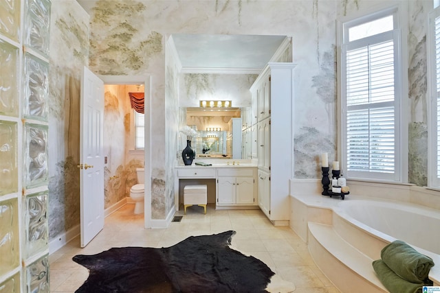 bathroom featuring tile patterned floors, toilet, a bath, and wallpapered walls