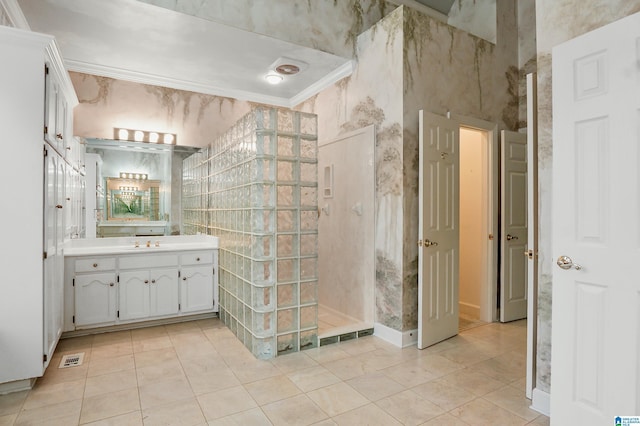 full bathroom with visible vents, tile patterned floors, walk in shower, crown molding, and vanity