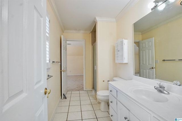 bathroom featuring toilet, ornamental molding, vanity, a shower stall, and tile patterned floors