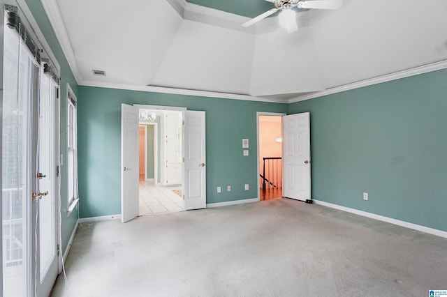 unfurnished bedroom featuring lofted ceiling, visible vents, crown molding, and baseboards