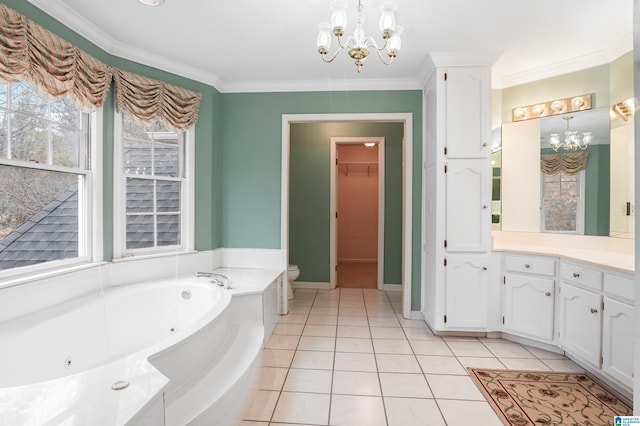 bathroom featuring an inviting chandelier, a tub with jets, crown molding, and tile patterned floors