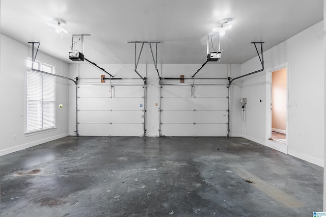 garage featuring baseboards and a garage door opener