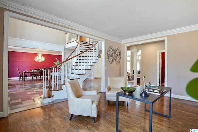 interior space featuring crown molding, a notable chandelier, stairway, wood finished floors, and baseboards