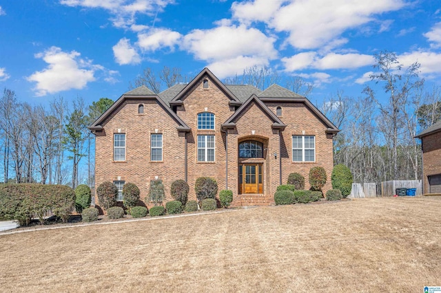 view of front of home featuring brick siding