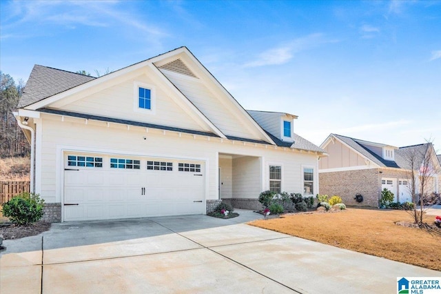 view of front of property featuring a garage and concrete driveway