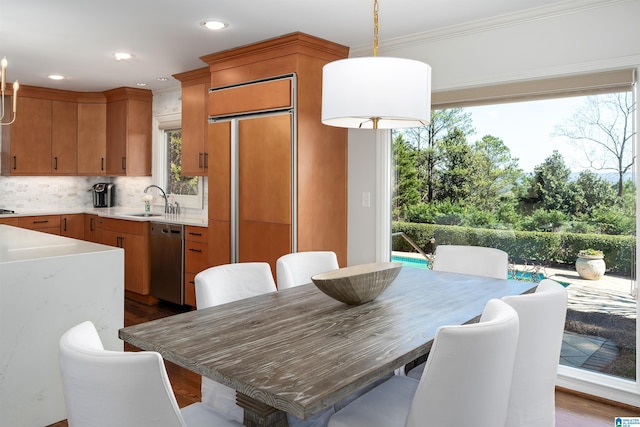 dining area with ornamental molding, recessed lighting, and dark wood finished floors