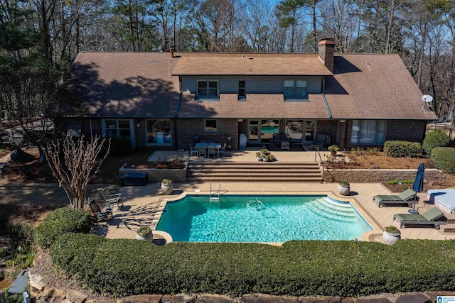 outdoor pool featuring a patio area