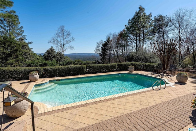 outdoor pool with a patio