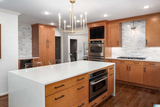 kitchen featuring light countertops, dark wood-style flooring, and gas cooktop