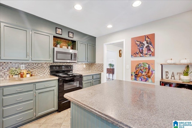 kitchen featuring open shelves, light tile patterned floors, stainless steel microwave, black range with electric stovetop, and decorative backsplash