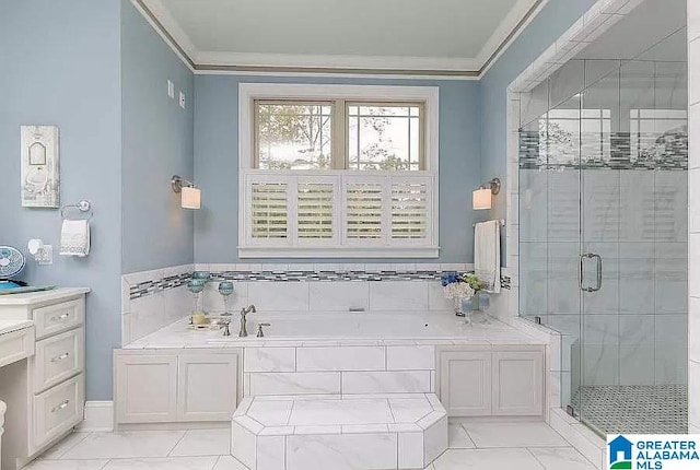 full bath with marble finish floor, a stall shower, a garden tub, and crown molding