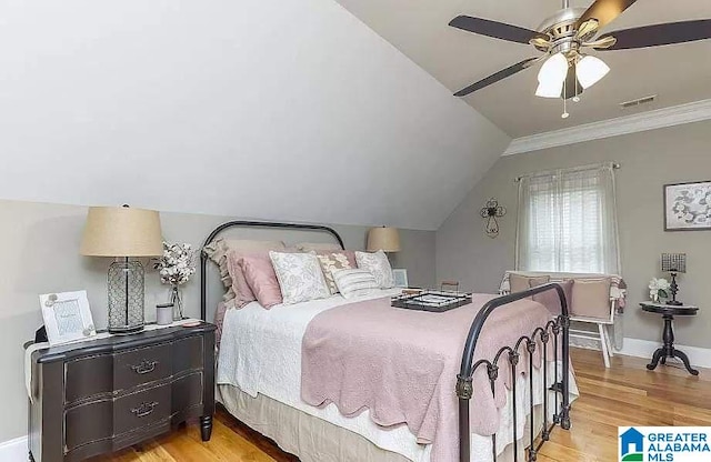 bedroom with lofted ceiling, visible vents, a ceiling fan, light wood-type flooring, and baseboards