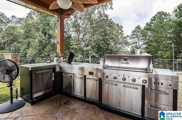 view of patio / terrace featuring exterior kitchen and grilling area