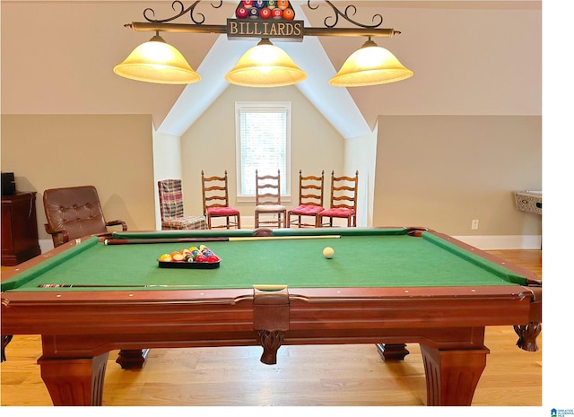 rec room featuring vaulted ceiling and wood finished floors