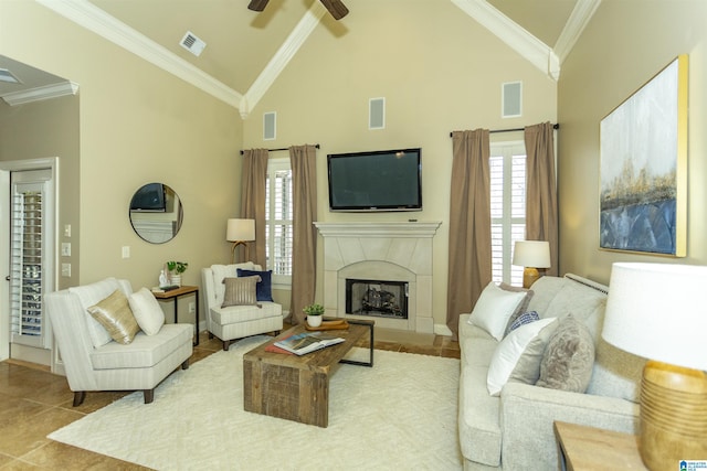 tiled living room with a high end fireplace, visible vents, and crown molding