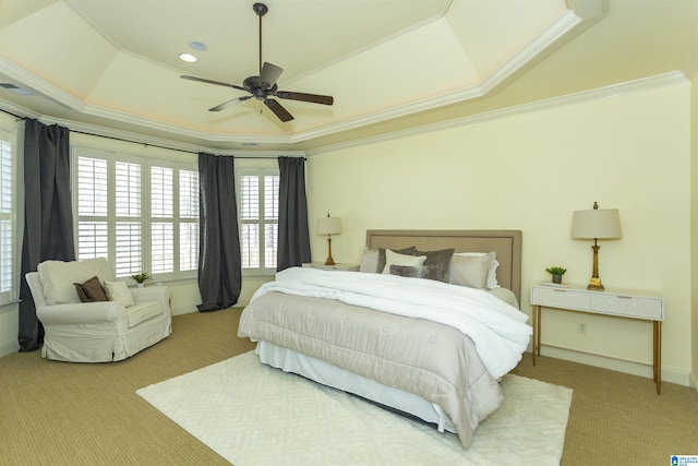 bedroom featuring ceiling fan, ornamental molding, a tray ceiling, carpet flooring, and recessed lighting