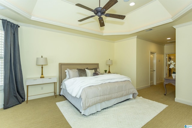 bedroom featuring a tray ceiling, crown molding, recessed lighting, visible vents, and baseboards