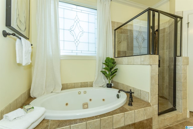 full bathroom featuring a whirlpool tub, a shower stall, and ornamental molding