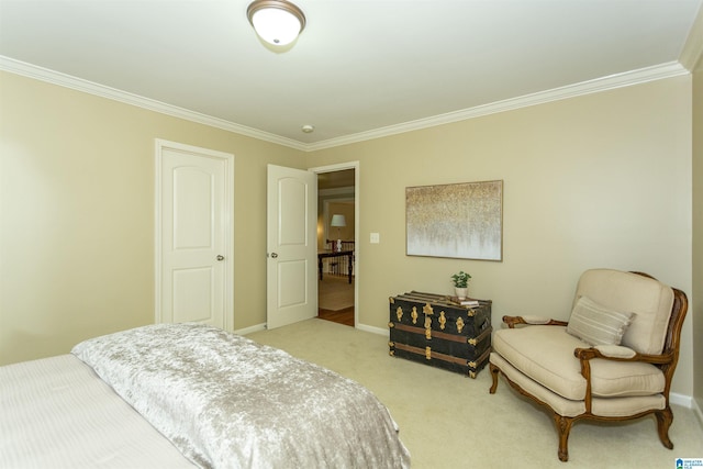 carpeted bedroom featuring baseboards and ornamental molding