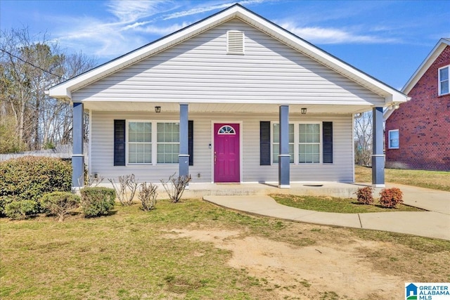 bungalow-style house with a porch and a front yard