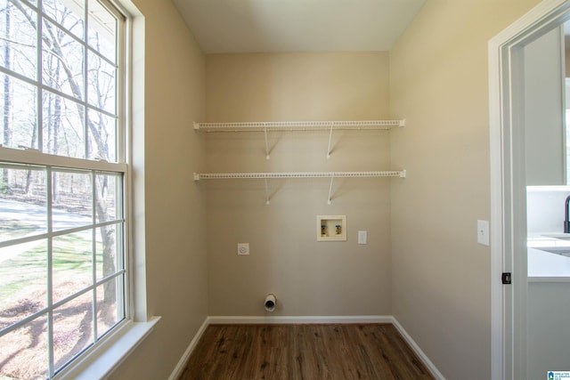 laundry room with washer hookup, dark wood-style flooring, electric dryer hookup, laundry area, and baseboards