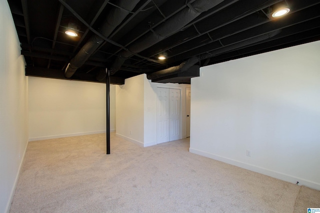 finished basement featuring carpet and baseboards