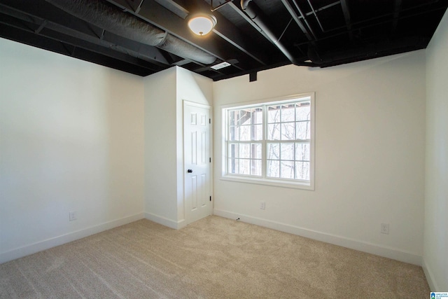 below grade area with carpet flooring and baseboards