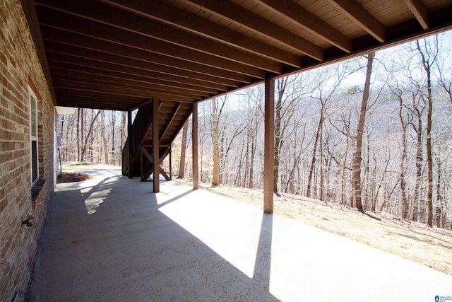 view of patio featuring a forest view