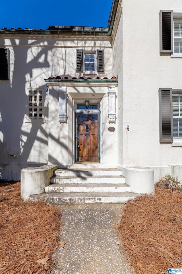 property entrance featuring visible vents