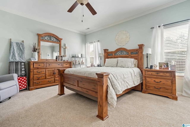 bedroom featuring light carpet, visible vents, crown molding, and ceiling fan