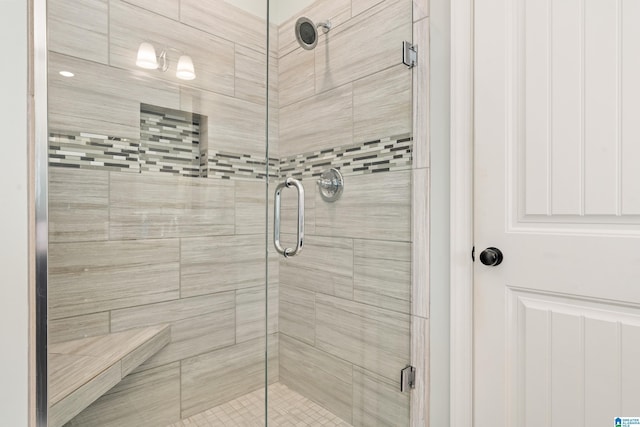 full bathroom with a shower stall