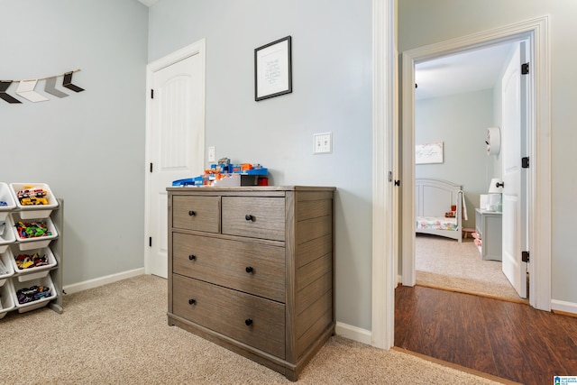 interior space with light carpet and baseboards