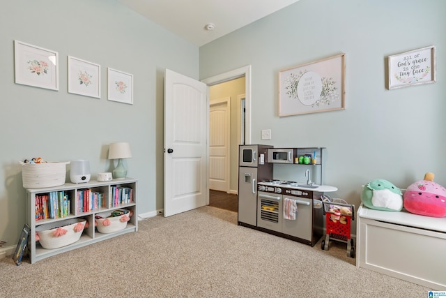 game room featuring carpet flooring and baseboards