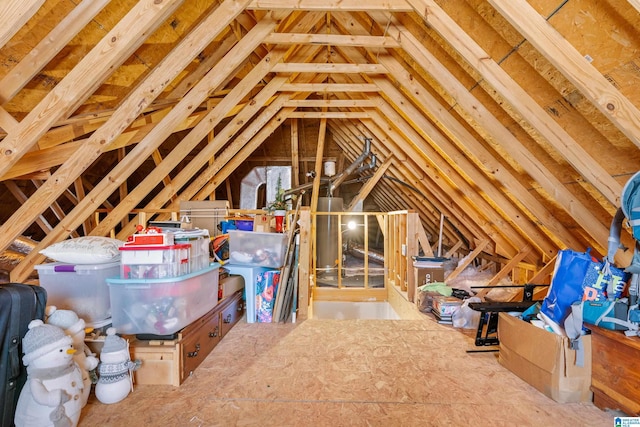 unfinished attic featuring an upstairs landing