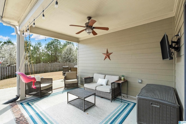 view of patio featuring outdoor lounge area, a ceiling fan, and fence