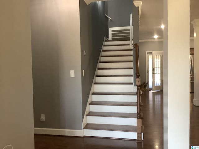 stairs featuring ornamental molding, recessed lighting, baseboards, and wood finished floors